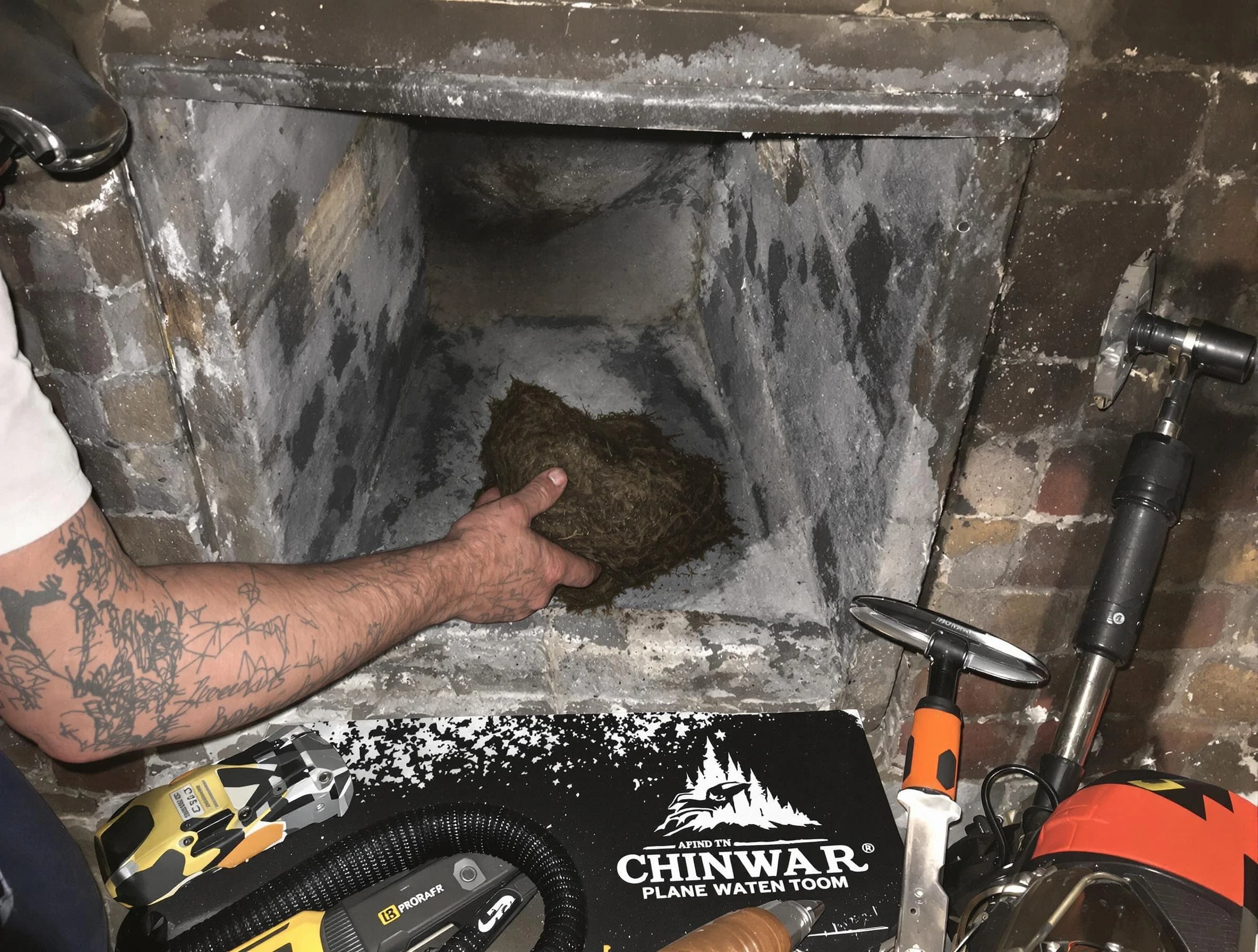 Birmingham Chimney Sweep safely removing debris and screening chimney in Birmingham, AL